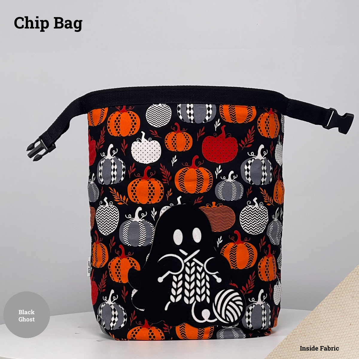Black pumpkin-print Chip Bag featuring a black ghost appliqué knitting beside a ball of yarn.