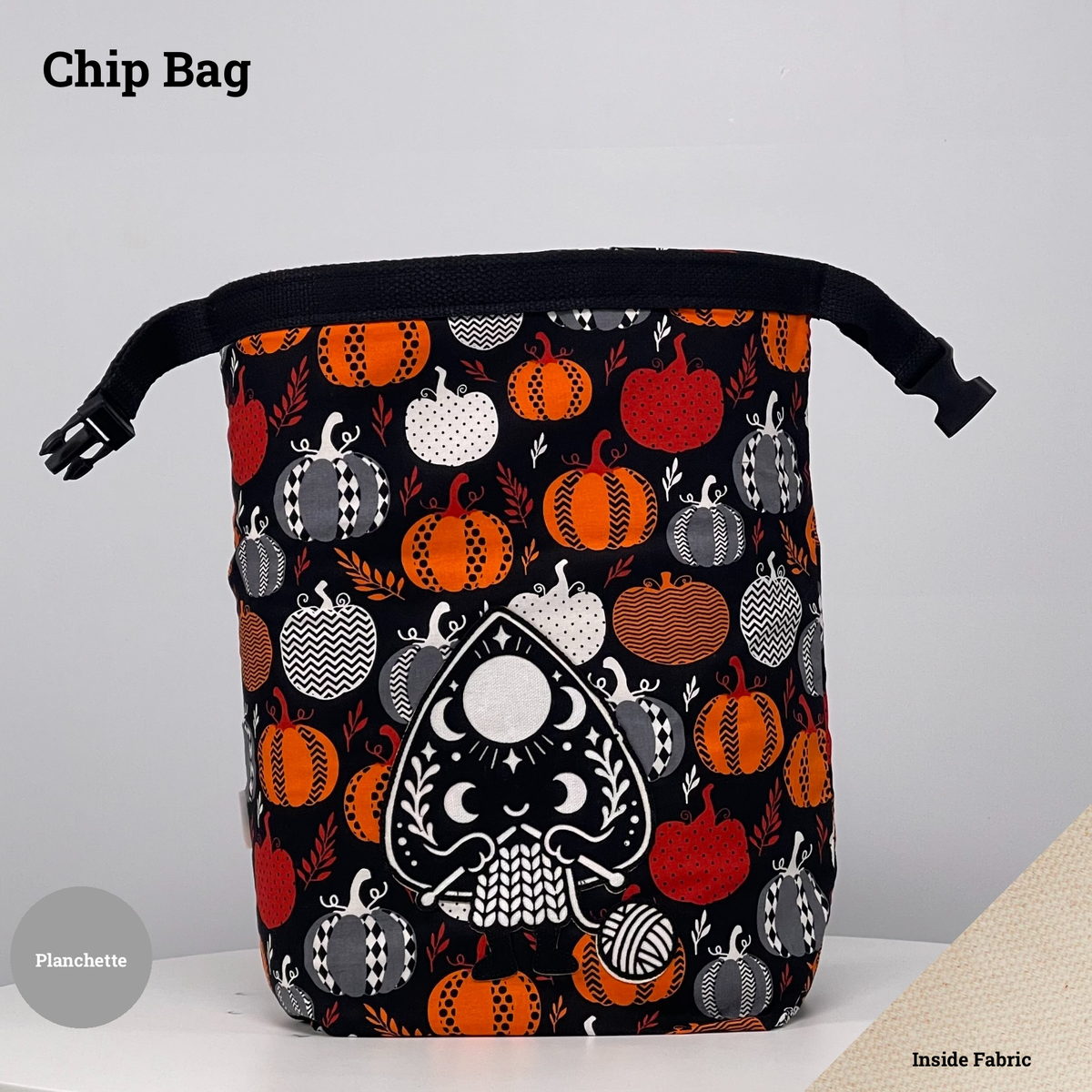 Black pumpkin-print Chip Bag featuring a planchette appliqué knitting beside a ball of yarn.